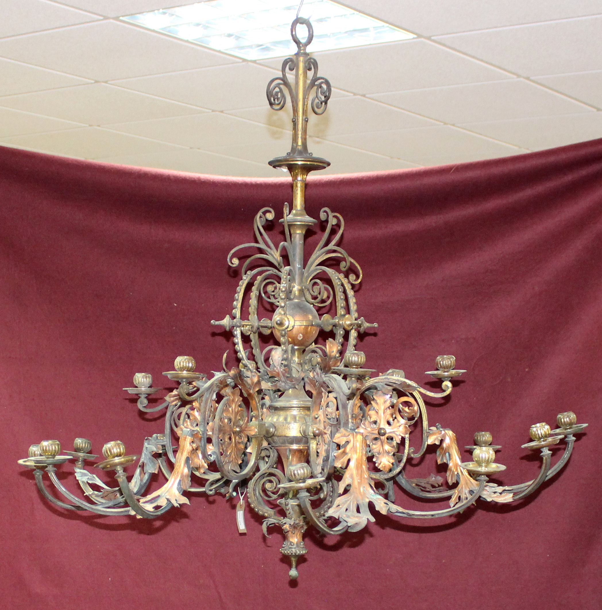 A late 19th Century gilt brass and copper six-branch eight-light chandelier with applied floral