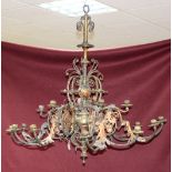 A late 19th Century gilt brass and copper six-branch eight-light chandelier with applied floral