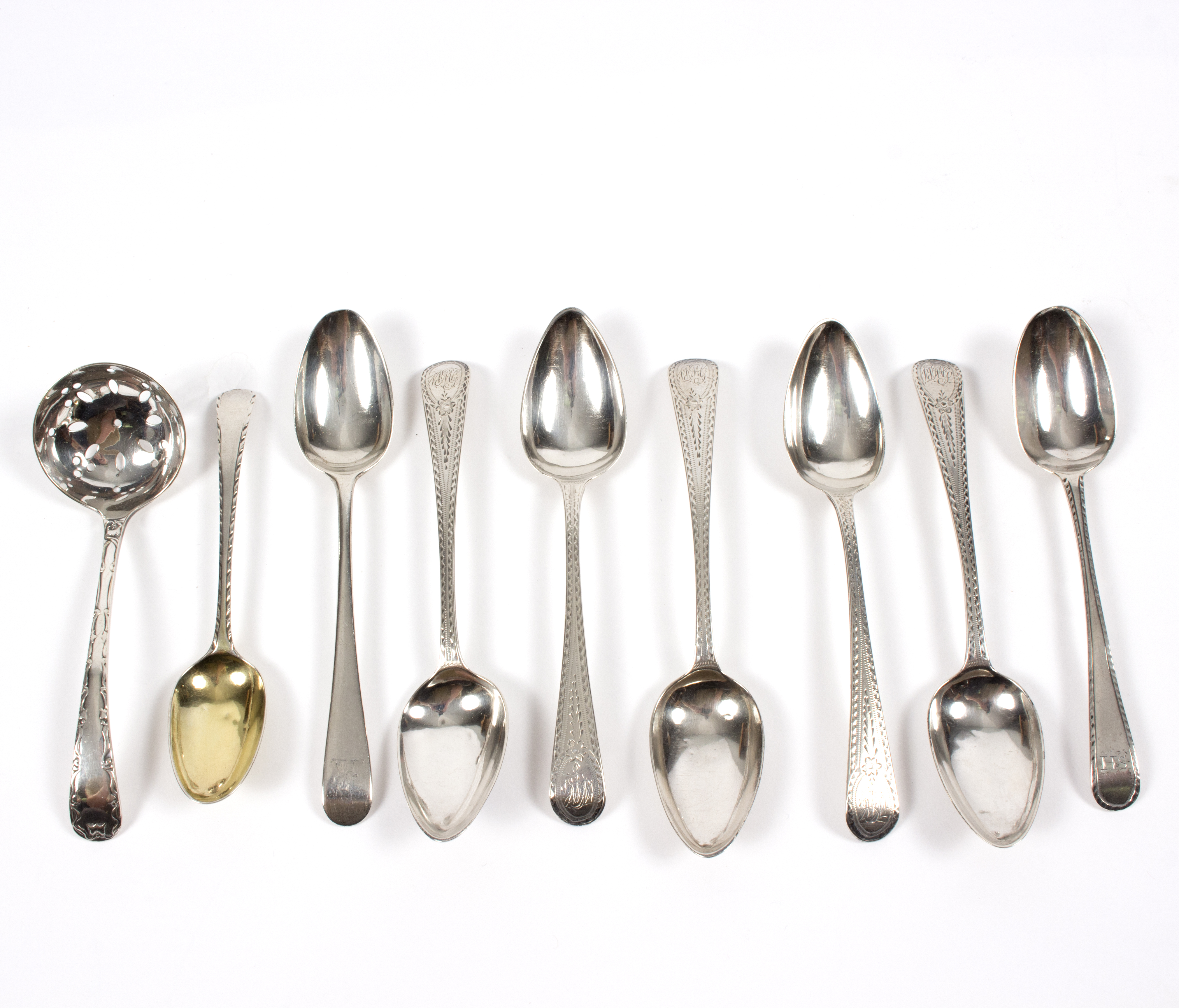 Six bright cut silver tea spoons, London 1796, two more and a plated sifting spoon,