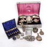 An Indian white metal tea set, boxed and a quantity of Eastern white metal including teaspoons,