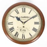 A circular kitchen dial in a walnut case, the white enamel dial bearing the name W J Carroll,