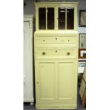 A painted food cupboard, fitted a glazed upper section above two drawers and a panelled cupboard,