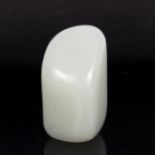A jade worry stone of pale celadon colour,