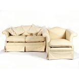 A two-seater sofa with ivory trellis pattern upholstery, fitted loose seat and back cushions,