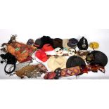 A selection of hats and related items to include an Eastern style headdress, a policeman's hat,