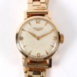 A 9ct gold Longines ladies wristwatch with champagne enamelled dial, gross weight 26.