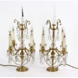 A pair of four-branch table candelabra,