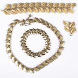 A Trifari gilt metal necklace of linked leaf form,