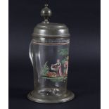 An early 19th Century glass tankard with pewter mounts and enamelled decoration of a fruit picker,