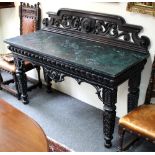 A late Victorian ebonised console table with pierced back,