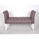 A modern button upholstered window seat in lilac,