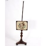 A 19th Century rosewood pole screen with rectangular beadwork panel to a turned column and triform