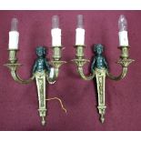 A set of eight two-branch wall lights, each with branches issuing from a patinated putto,