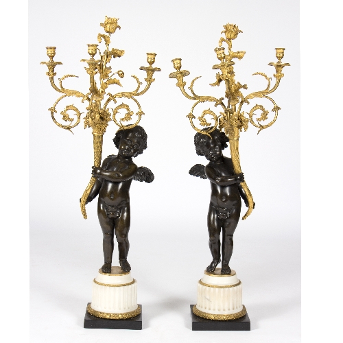 A pair of mid 19th Century ormolu three-branch three-light candelabra,