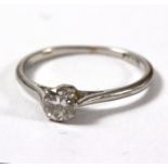 A diamond solitaire ring, measuring approximately 0.