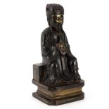 A 19th Century bronze figure of Confucius, seated and with some gilded glaze, 25.