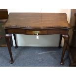 A mahogany serpentine front tea table fitted a drawer to the frieze, on cabriole front legs,