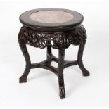 A Chinese hardwood jardiniere stand with marble top, the whole carved flowers and foliage,