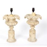 A pair of alabaster urns mounted as lamps,