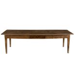 A French fruitwood farmhouse table, the long rectangular top on square tapering legs,