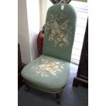 A Victorian walnut framed nursing chair,