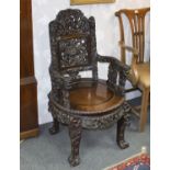 A Chinese carved hardwood armchair,