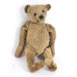 A Steiff teddy bear with jointed limbs and blonde fur, button to ear, a/f,