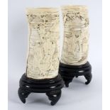 A pair of Meiji period ivory tusks finely carved figures and foliage in relief Condition