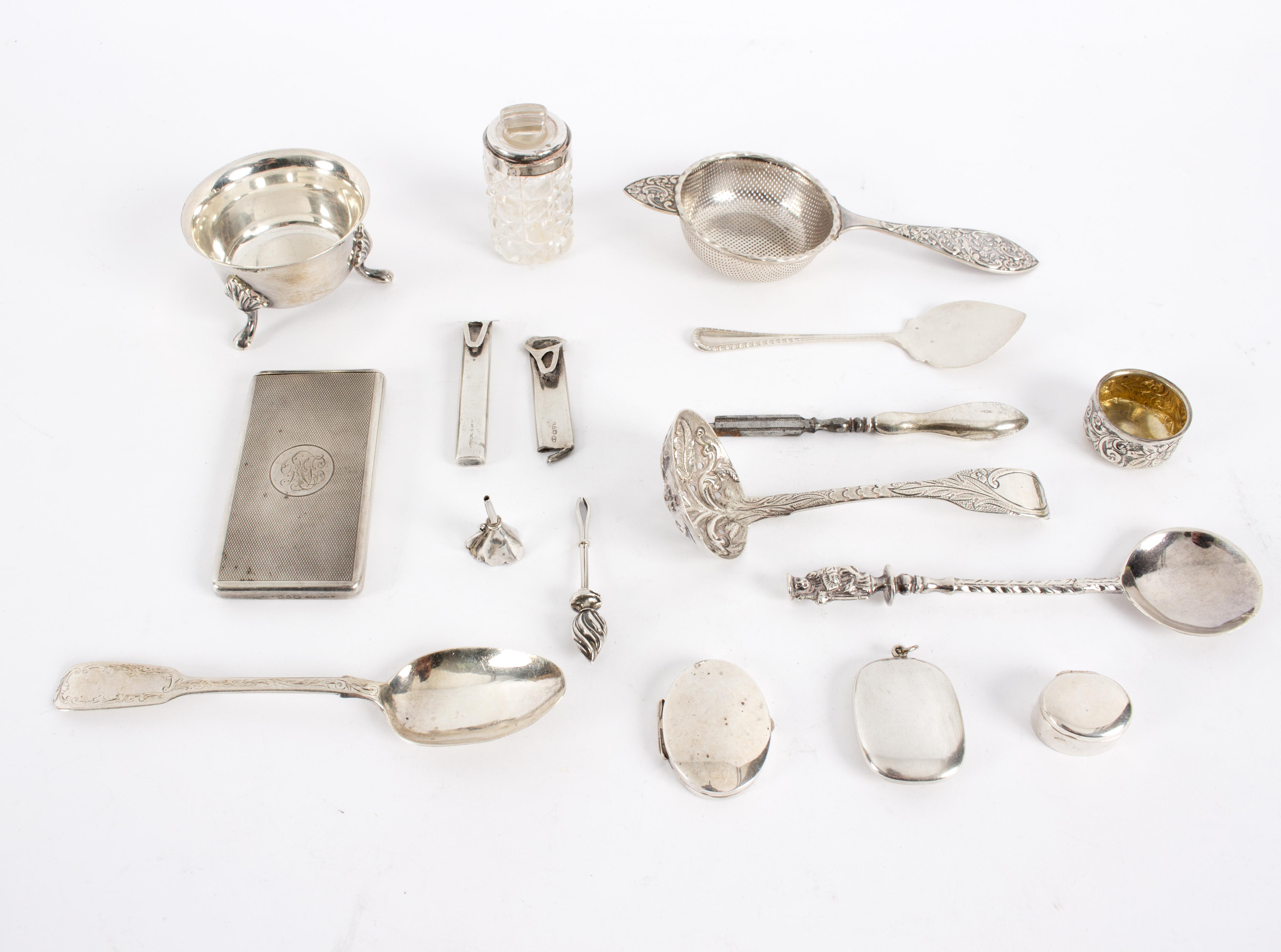 A small quantity of silver including tea strainer, posy holder, card case etc,