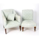 A Victorian upholstered chair on turned legs and another chair with matching upholstery