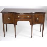 A George III mahogany and inlaid serpentine front sideboard,