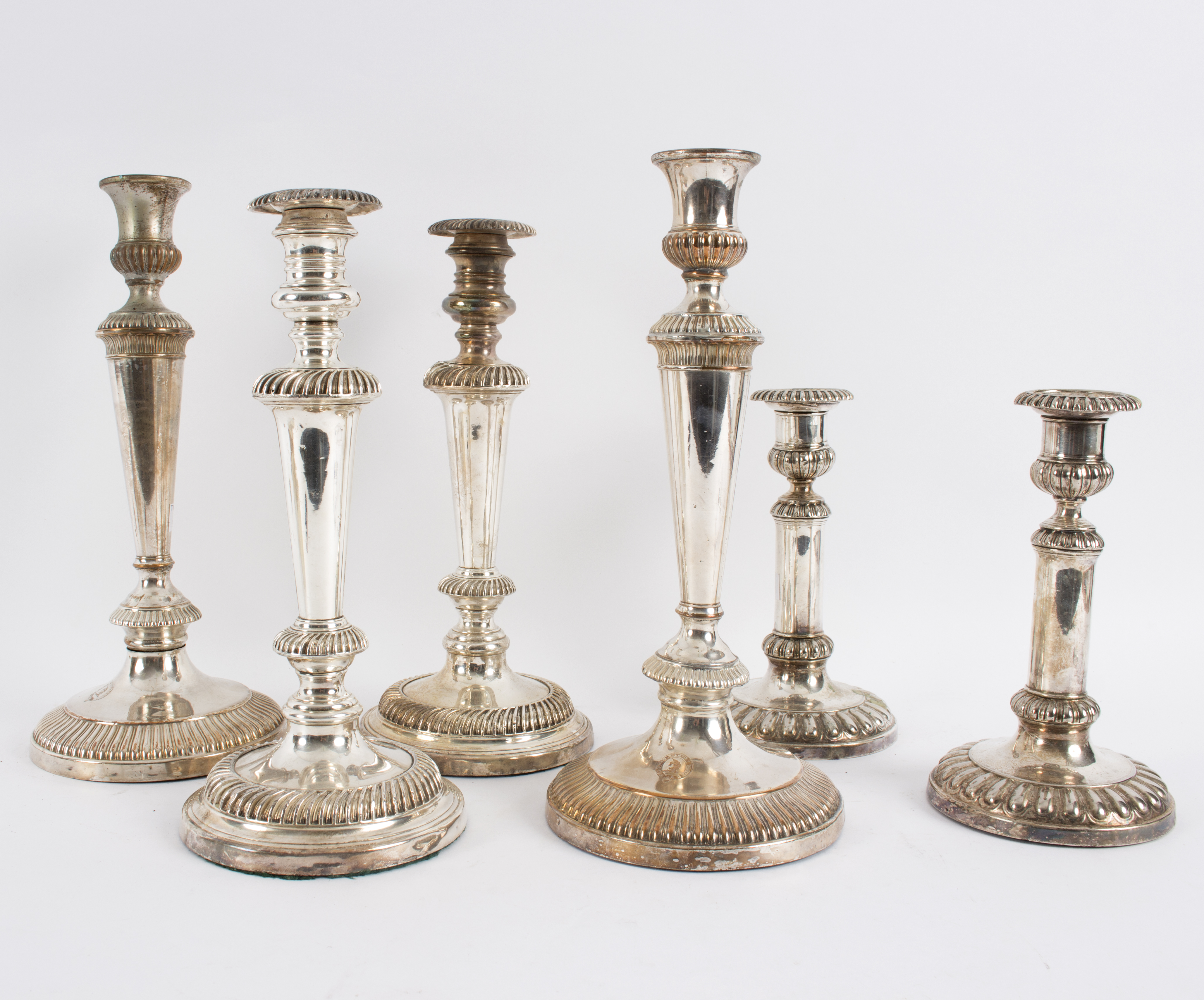 Three pairs of plated candlesticks