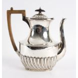 A Victorian hot water jug, Sheffield 1888, of half-ribbed form, 20.