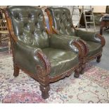 A pair of late 19th Century mahogany armchairs with carved frames,