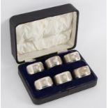 A set of six silver napkin rings, GUS & L, Birmingham 1931, with engine turned decoration,