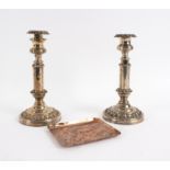 A pair of Regency silver plated telescopic candlesticks, the round bases with moulded borders,