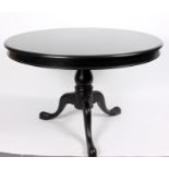 A grey painted circular table on a turned column and tripod support,