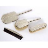 A silver four-piece part dressing set,