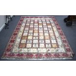 An Shivan carpet decorated a grid of stylised birds and motifs,