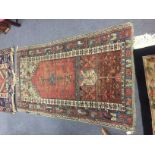 A Turkish rug on a camel ground, 205cm x 121cm and a South Caucasian prayer rug,