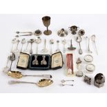 A large quantity of silver comprising souvenir teaspoons, a compact with tortoiseshell cover,