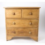 A pine chest of two short above two long drawers,