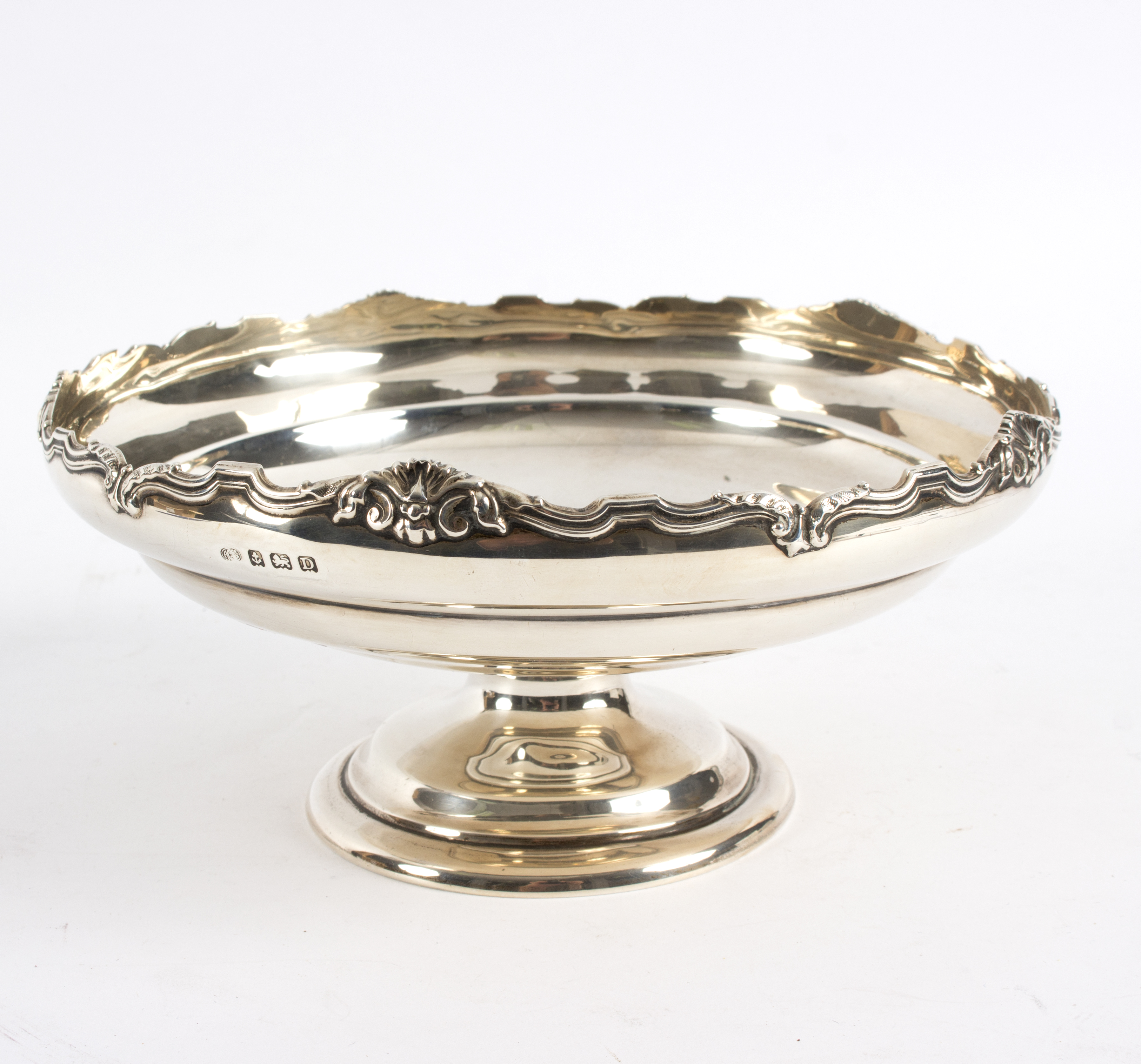 A silver pedestal bowl, Birmingham 1920 with shell and scroll rim to a circular foot, 20.