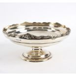 A silver pedestal bowl, Birmingham 1920 with shell and scroll rim to a circular foot, 20.
