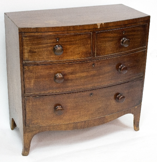 A Regency bowfront chest of two short over two long drawers, 89.