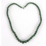 A single row of graduated jade beads,
