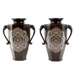 A pair of octagonal Japanese cloisonné vases with twin elephant mask handles,