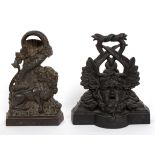 A cast iron door stop in the form of a lion and serpent, 28cm high and another Medusa,