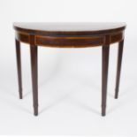 An early 19th Century mahogany half-round card table, crossbanded in satinwood,