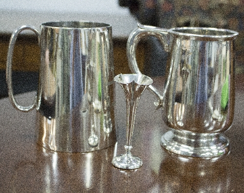 Two silver tankards, approximately 740gm and a small vase,